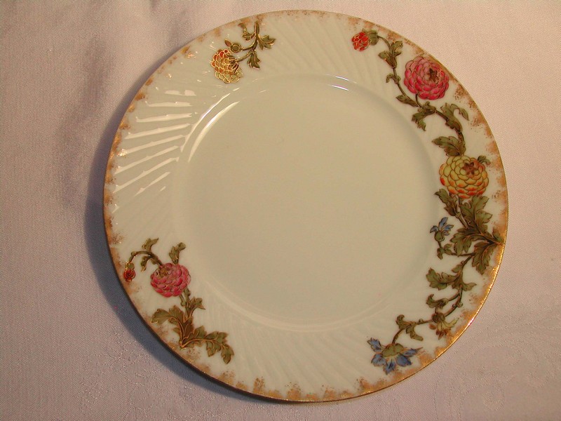 A lovely set of Antique Limoges Wild Flower Plates Jean Pouyat